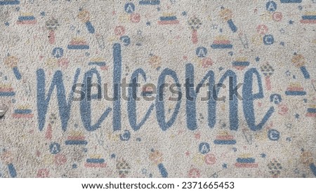 Entrance floor mat with welcome sign