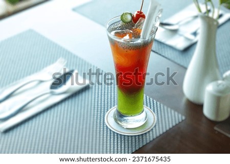 Red and green cocktail on the restaurant table