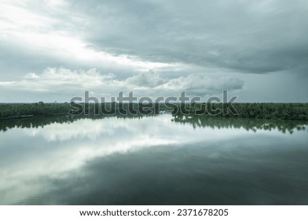 Kerala nature landscape scenery, Beautiful river view with moody clouds, Aerial drone shot from Kavvayi island Kannur, Kerala travel and tourism concept image Royalty-Free Stock Photo #2371678205