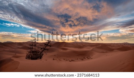 View of old ship shipwreck on the Sahara Desert at sunset - Notrh Africa, Morocco