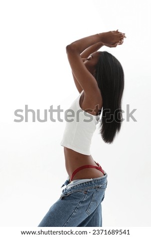 Side view of young lovely woman with dark skin isolated over white background. 