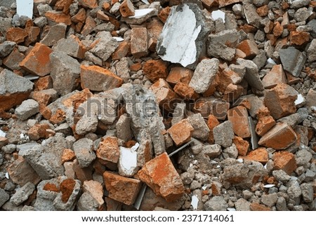 demolished brick wall on construction site Royalty-Free Stock Photo #2371714061