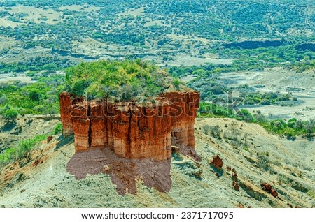 Close-up of monolith made of red sediments at he Olduvai Gorge or Oldupai Gorge in Tantzania,  one of the most important paleoanthropological localities in the world. 