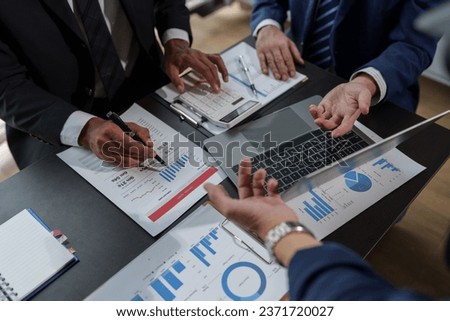 Asian business advisor meeting to analyze and discuss the situation on the financial report in the meeting room. brainstorming, discussing, and analyzing business strategy. Financial advisor concept Royalty-Free Stock Photo #2371720027