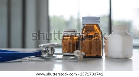 Medicine and stethoscope placed on the doctor's desk health care medicine. Royalty-Free Stock Photo #2371733741