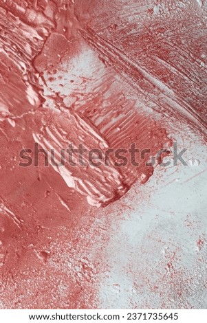 The photo shows lip gloss in the shape of a heart. Image photography. Advertising photography. Lip gloss texture.