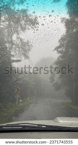 Picture of rain mist on Doi Phukha Road, taken from inside a car on National Highway 1256, Pua, Bo Kluea District, Nan.