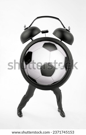 Retro Alarm Clock with football ball inside standing on feet on white background. Time for Football concept