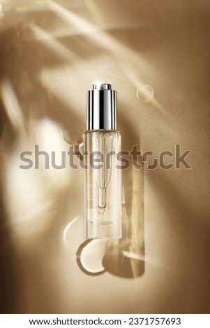 Transparent skin care product essence water refracts light shadow skin care Royalty-Free Stock Photo #2371757693