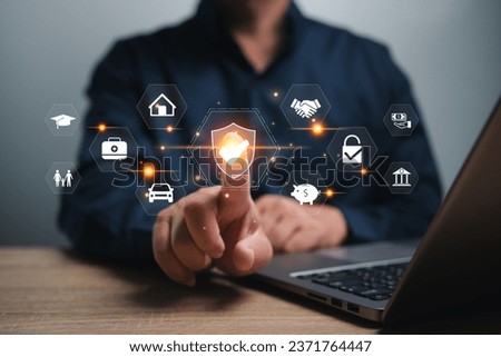 Insurance and employee benefits concept, Businessman use laptop to show insurance icons, Indirect and non-cash compensation paid to employees, Health, vehicles, finances, education, long-term planning Royalty-Free Stock Photo #2371764447