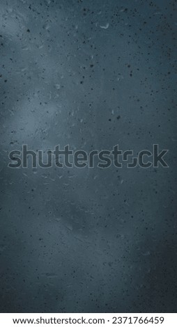rain water drops on glass with shadows