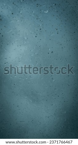 rain water drops on glass with shadows