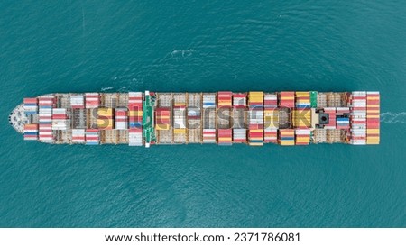 top view cargo ship carrying container and running for export goods from cargo yard port to custom ocean concept freight shipping by ship 