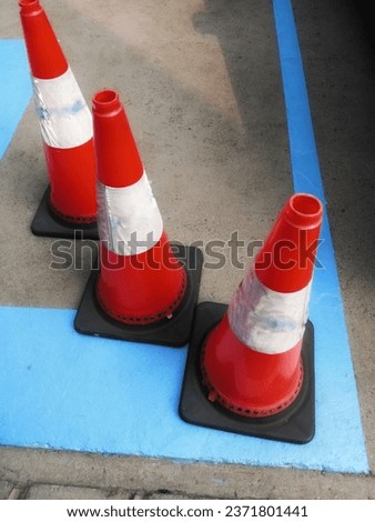 traffic cones are on the blue line