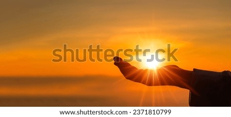 Silhouette of prayer woman worship God in the morning with sunrise sky background. Person hands open palm up worship. God helping repent catholic easter lent mind pray. Christian religion concept. Royalty-Free Stock Photo #2371810799