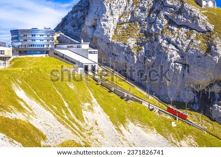 Mount Pilatus peak descent on worlds steepest cogwheel railway, 48 percent, tourist landscape of Switzerland Royalty-Free Stock Photo #2371826741
