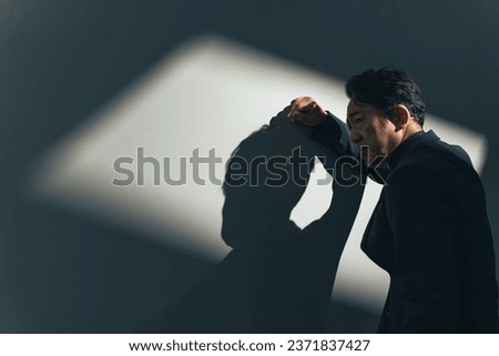 Portrait of a frustrated middle-aged Asian man. Royalty-Free Stock Photo #2371837427