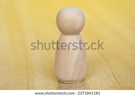 Close up of Isolated figure on yellow background with customizable space for text.