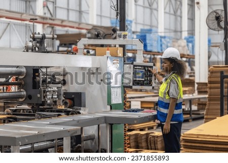 Cardboard production technician ensure efficient setup of the automated stitching machine, focusing on material alignment, quality control, and swift troubleshooting to enhance smoothing procedure.