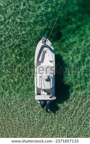 Beautiful colorful aerial picture boat and guy fishing 