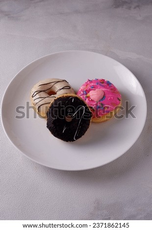 Various kinds of donuts which are children's favorite food. Isolated. Copy space. Menu. Flatlay. Food Photography