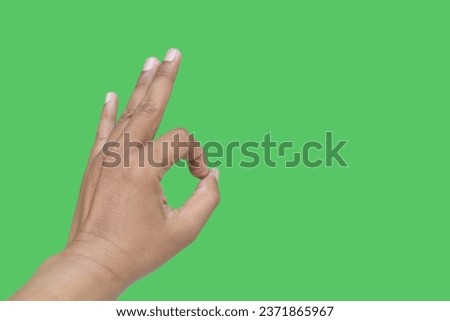 Hand gesture, Asian Man, isolated on green background.
