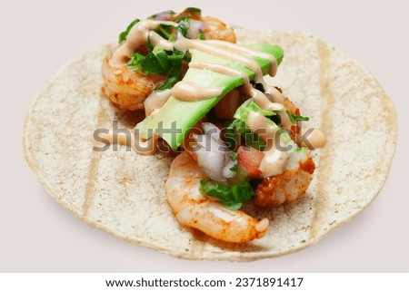 Shrimps tacos, vegetables, avocado. with Pineapple Chipotle Sauce, Mexican food.