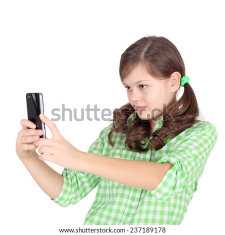 pretty little girl shooting by her mobile phone