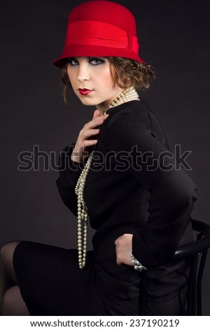 Young beuriful woman in style of 1920 like Coco Chanel 