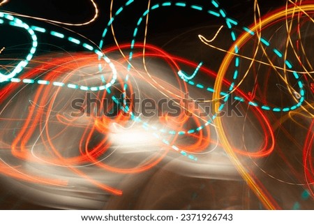 abstract background, motion blur trail lights, real led lights moving fast on a slow camera shutter speed