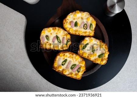 Garlic and herb bread slices
. Tasty bread with garlic, cheese and herbs on kitchen table. Plate with delicious homemade garlic bread on table

 Royalty-Free Stock Photo #2371936921