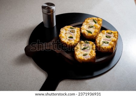 Garlic and herb bread slices
. Tasty bread with garlic, cheese and herbs on kitchen table. Plate with delicious homemade garlic bread on table

 Royalty-Free Stock Photo #2371936931