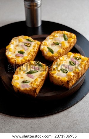 Garlic and herb bread slices
. Tasty bread with garlic, cheese and herbs on kitchen table. Plate with delicious homemade garlic bread on table

 Royalty-Free Stock Photo #2371936935