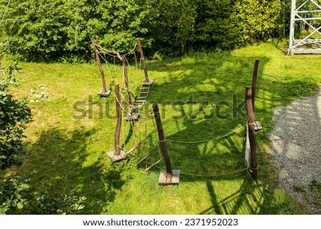 Abstract photograph of a children's playground from a top view. Children's rope playground in the wild. Top view, game, obstacles, challenges, material, natural material, childhood, fun.