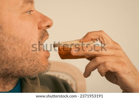 43 year old man eats bread