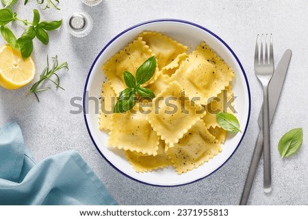 Ravioli with ricotta cheese and fresh basil, top view Royalty-Free Stock Photo #2371955813