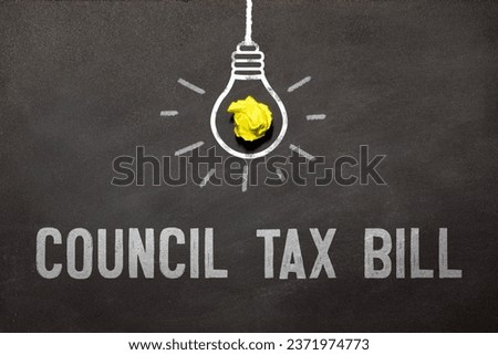 coUNCIL TAX BILL is written in a white notepad near a clipboard, calculator, green plant, glasses and a pen on a yellow and concrete backgroundd.