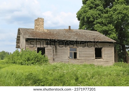 Abandoned wooden farmhouse in Sece, Latvia Royalty-Free Stock Photo #2371977201