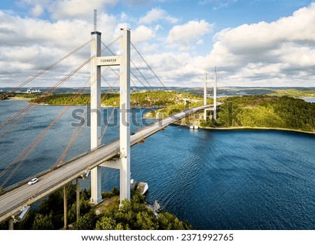 Aerial view of Tjörnbron, a cable-stayed bridge connecting mainland to the island of Tjörn. Inaugurated in 1981 after the former Almö bridge collapsed in a ship collision in 1980. Royalty-Free Stock Photo #2371992765