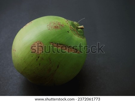 Small coconuts on a black background