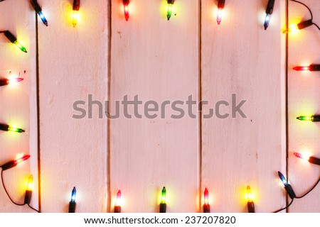christmas light decorations on wood texture