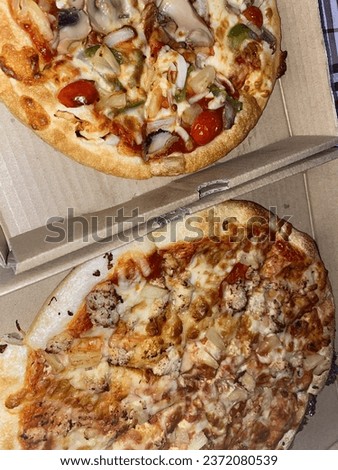 Two mouth-watering pizzas for lunch.