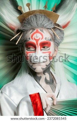 Rabbit woman with asian style Halloween makeup and mask, closeup portrait