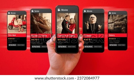 Person browsing movies online on mobile phone and viewing cinema ratings and reviews