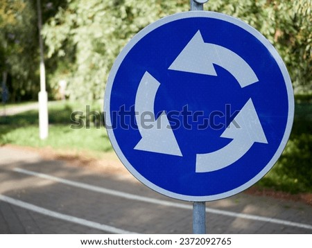 Roundabout traffic sign on green background