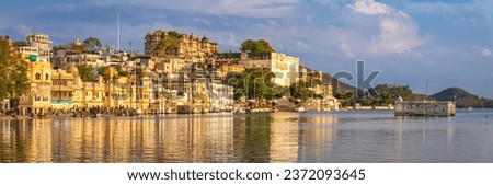 Panoramic view of city of lakes, Udaipur with lake Pichola from Ambrai ghat, Rajasthan, India. Royalty-Free Stock Photo #2372093645