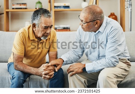 Men, sofa and support with friends in communication, hand gesture and grief with pain or loneliness. Elderly men, diversity and conversation on mental health or emotional counselling on sad with loss Royalty-Free Stock Photo #2372101425