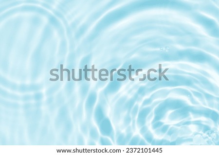 Water texture surface with drop,ripples,splash,Aqua Blue background banner transparent of water waves in sunlight with copy space,Top view Backdrop for summer Cosmetic,Moisturiser water micellar toner
