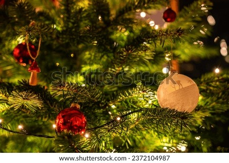 Different baubles hanging on chistmas tree