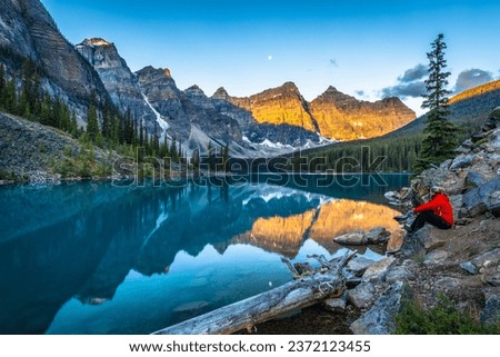 Alpine lake in mountains at sunrise. Moraine Lake in Banff National Park, Canadian Rockies, Alberta, Canada. Royalty-Free Stock Photo #2372123455